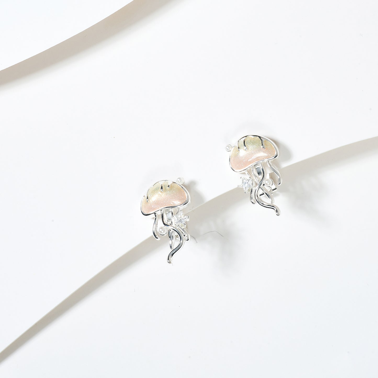 Aretes de Clip Medusas en Acero